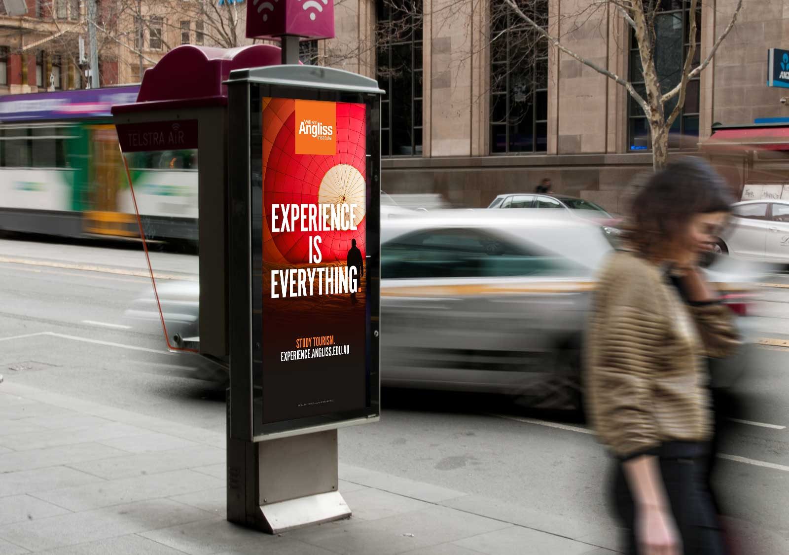 Public telephone booth advertising - poster with the headline 'Experience is Everything'