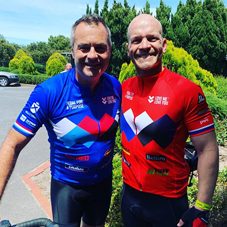 LMLY Instagram Post | Two male cyclists wearing Love Me Love You branded bibs